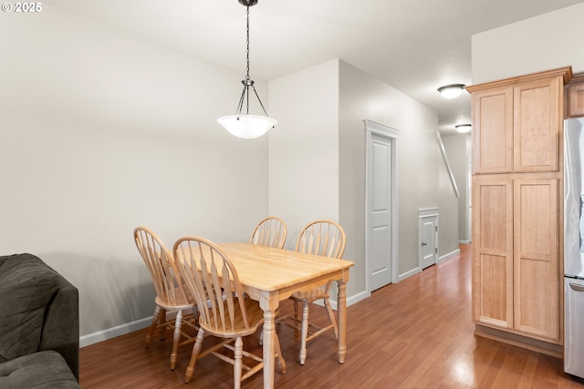 dining room with light hardwood / wood-style flooring