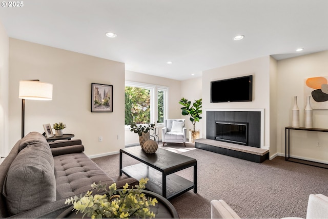 1442 SW 66th Ave, Portland, OR 97225 - carpeted living room with recessed lighting and a tile fireplace