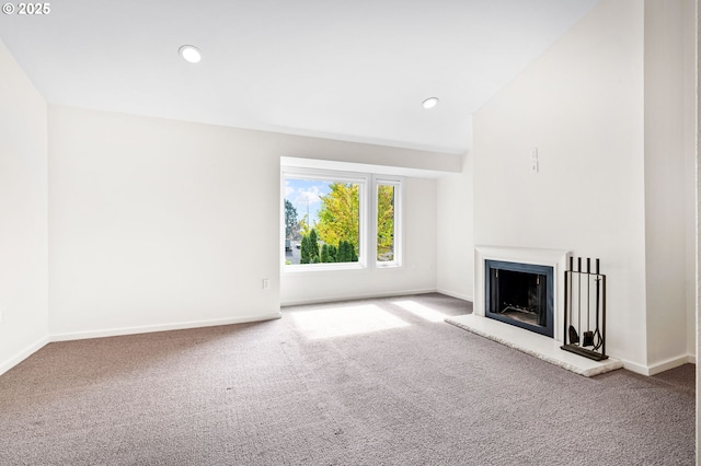 1442 SW 66th Ave, Portland, OR 97225 - unfurnished living room with carpet, a fireplace with raised hearth, and recessed lighting