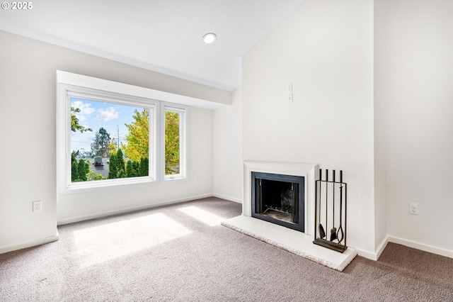 1442 SW 66th Ave, Portland, OR 97225 - unfurnished living room with carpet floors, a fireplace with raised hearth, and recessed lighting