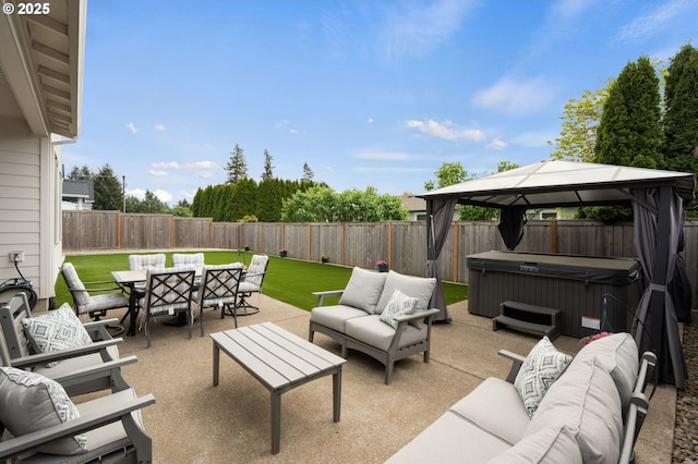 view of patio / terrace featuring outdoor dining space, a gazebo, a hot tub, a fenced backyard, and an outdoor living space