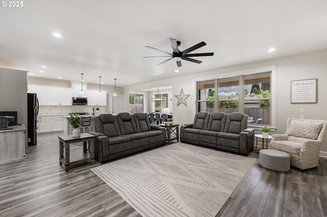 living room featuring recessed lighting, ceiling fan, and wood finished floors