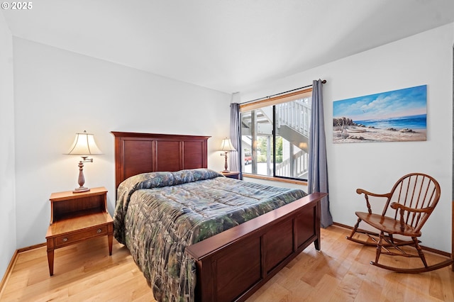 765 5th Ave Unit 5, Hammond, OR 97121 - bedroom featuring light wood-style flooring and baseboards