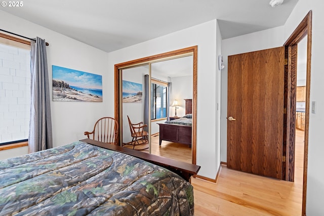 765 5th Ave Unit 5, Hammond, OR 97121 - bedroom with light wood-style flooring