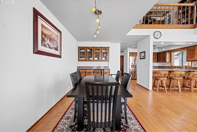 765 5th Ave Unit 5, Hammond, OR 97121 - dining space with light wood finished floors and rail lighting
