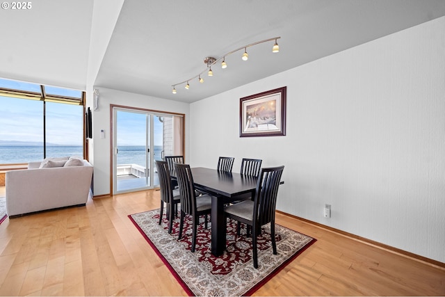 765 5th Ave Unit 5, Hammond, OR 97121 - dining space featuring light wood finished floors and a water view