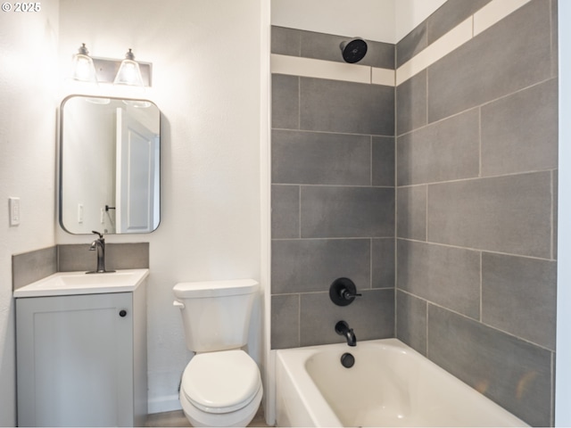 full bath featuring vanity, baseboards, shower / bathtub combination, and toilet