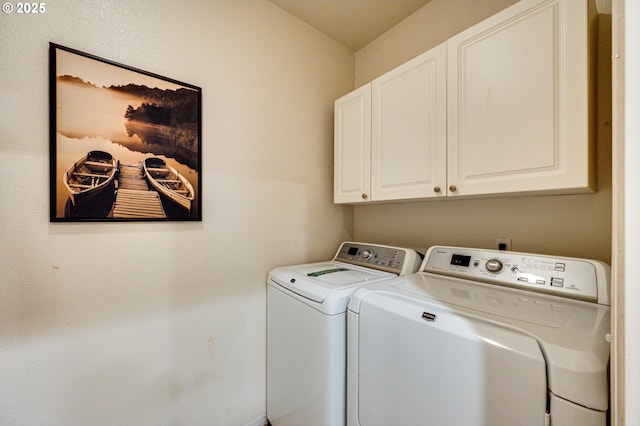 laundry area with cabinets and separate washer and dryer