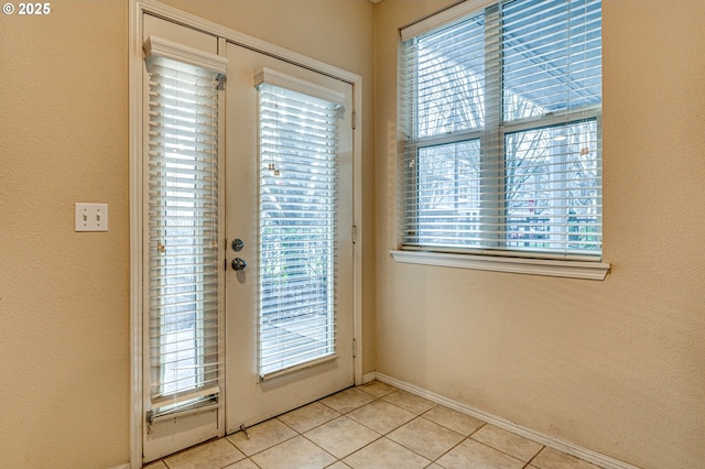 doorway featuring light tile patterned floors