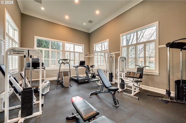 gym featuring crown molding