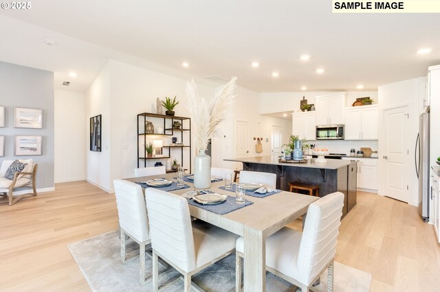 dining area with light wood-type flooring