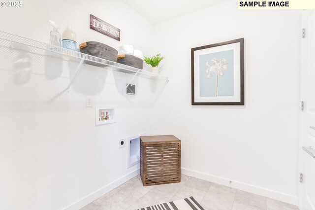 laundry room with washer hookup, hookup for an electric dryer, and light tile patterned floors