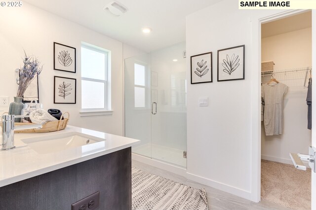 bathroom with vanity and walk in shower