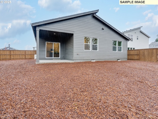 back of house with a patio