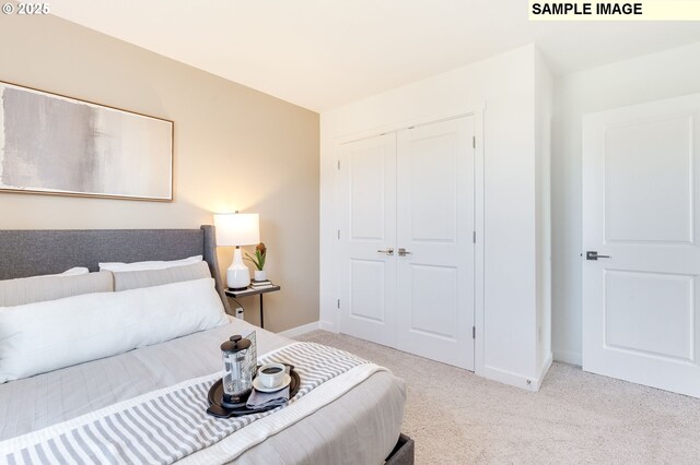 carpeted bedroom with a closet