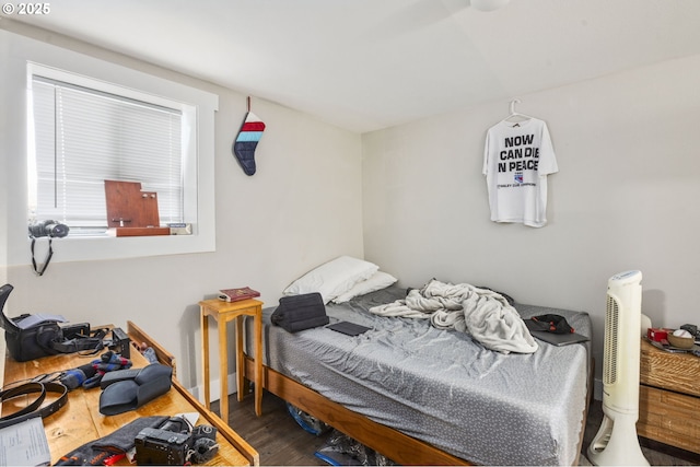 bedroom with wood finished floors