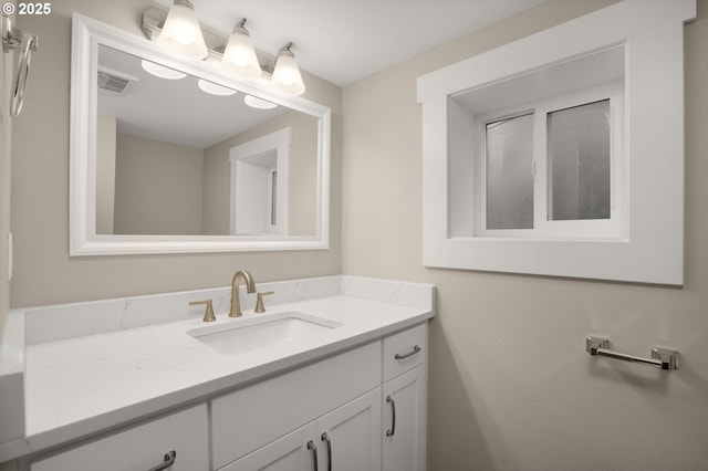 bathroom featuring visible vents and vanity