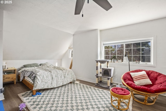 bedroom featuring lofted ceiling, ceiling fan, and wood finished floors