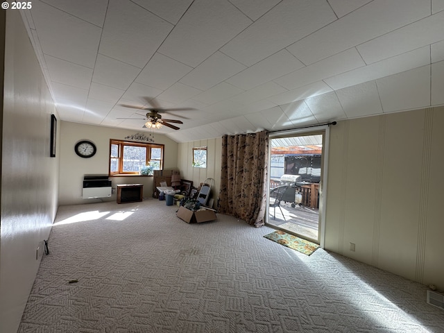 346 N Humbolt St, Canyon City, OR 97820 - interior space with carpet flooring, a decorative wall, a ceiling fan, heating unit, and vaulted ceiling