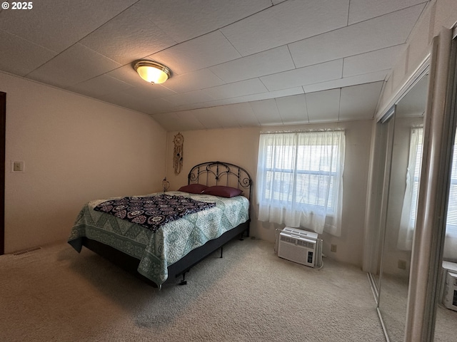 346 N Humbolt St, Canyon City, OR 97820 - bedroom featuring light colored carpet, vaulted ceiling, visible vents, and a wall mounted air conditioner
