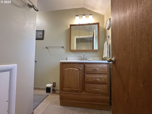 346 N Humbolt St, Canyon City, OR 97820 - bathroom featuring baseboards, vaulted ceiling, tile patterned floors, and vanity