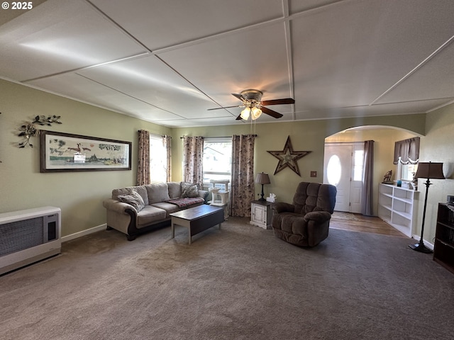 346 N Humbolt St, Canyon City, OR 97820 - living area featuring arched walkways, heating unit, a ceiling fan, and carpet