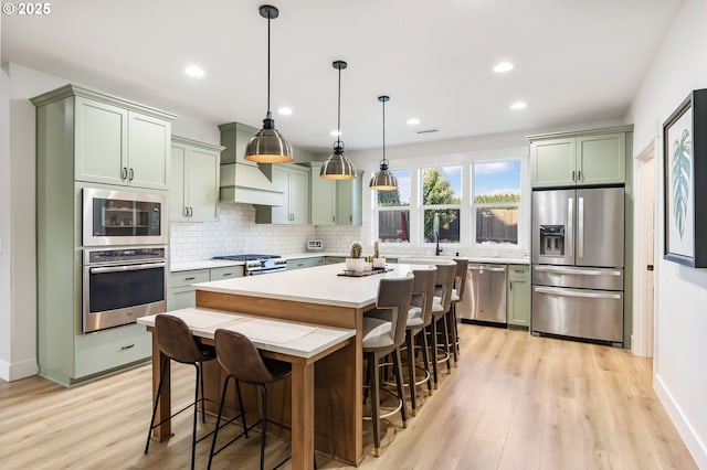 14015 NE 52nd Ave, Vancouver, WA 98686 - kitchen with stainless steel appliances, green cabinets, light countertops, tasteful backsplash, and recessed lighting