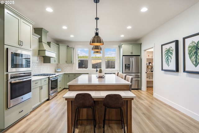 14015 NE 52nd Ave, Vancouver, WA 98686 - kitchen featuring appliances with stainless steel finishes, green cabinetry, light countertops, and recessed lighting
