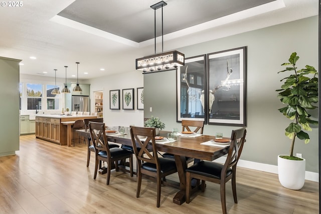 14015 NE 52nd Ave, Vancouver, WA 98686 - dining room with light wood-style floors, recessed lighting, a tray ceiling, and baseboards