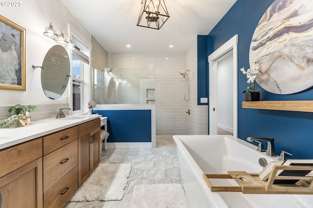 14015 NE 52nd Ave, Vancouver, WA 98686 - bathroom with a freestanding bath, walk in shower, double vanity, a chandelier, and marble finish floors