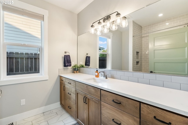 14015 NE 52nd Ave, Vancouver, WA 98686 - bathroom featuring vanity, baseboards, a shower, and marble look tiles