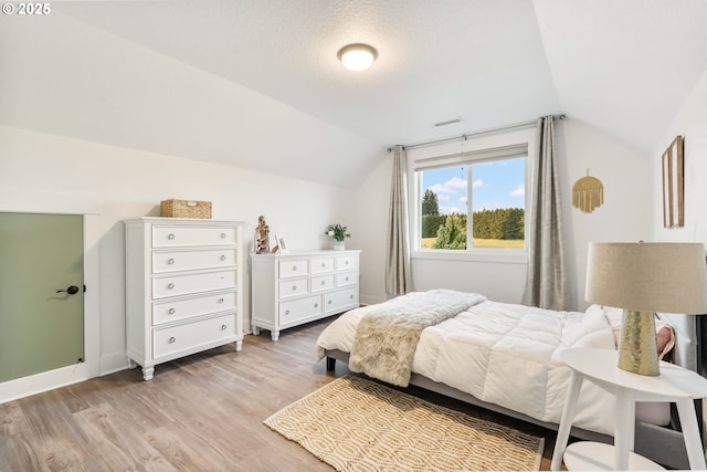 14015 NE 52nd Ave, Vancouver, WA 98686 - bedroom with vaulted ceiling, light wood-type flooring, and baseboards