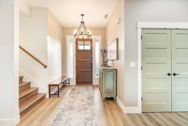 14015 NE 52nd Ave, Vancouver, WA 98686 - foyer entrance with light wood-style flooring, a chandelier, stairs, and baseboards