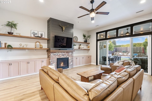 14015 NE 52nd Ave, Vancouver, WA 98686 - living room with light wood-type flooring, recessed lighting, ceiling fan, and a brick fireplace