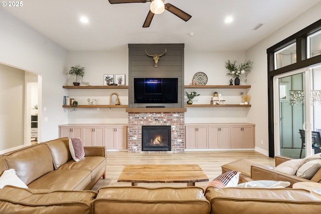 14015 NE 52nd Ave, Vancouver, WA 98686 - living room featuring a fireplace, light wood-type flooring, a ceiling fan, recessed lighting, and baseboards