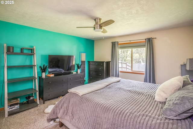 bedroom with carpet floors and a ceiling fan