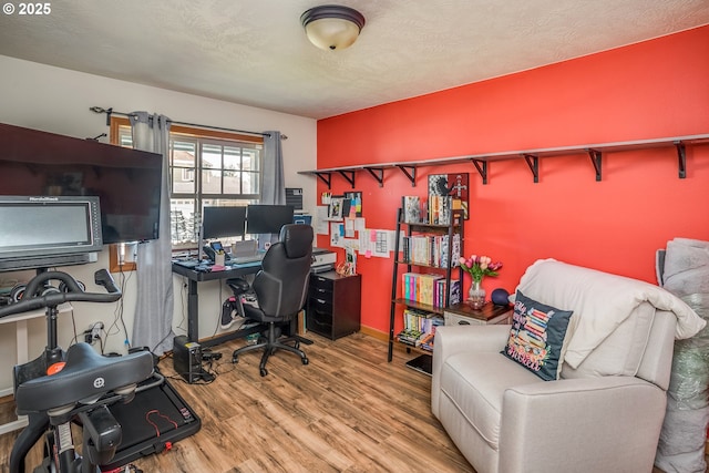 office area featuring wood finished floors and baseboards