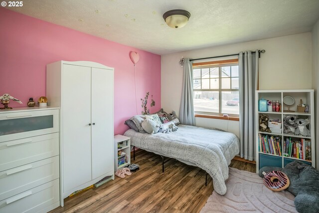 bedroom featuring wood finished floors