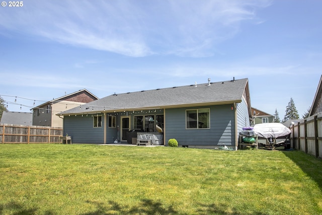 back of house with a hot tub and a shingled roof