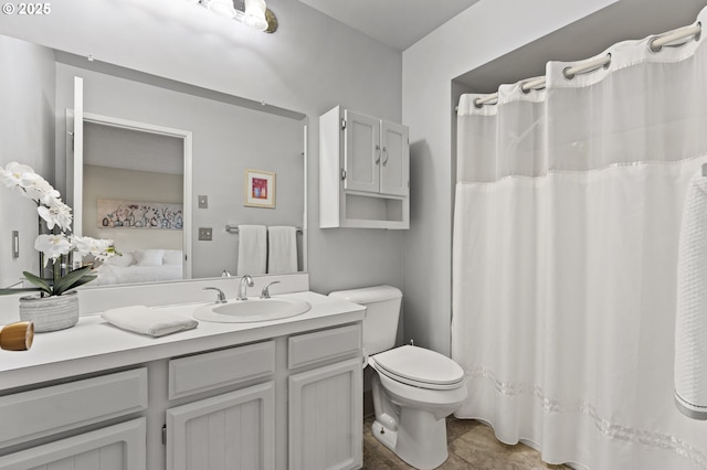 bathroom featuring vanity and toilet