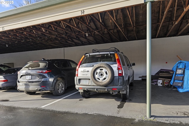 view of parking / parking lot with a carport