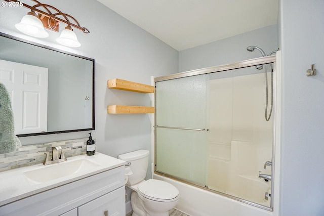 full bathroom featuring toilet, vanity, shower / bath combination with glass door, and decorative backsplash