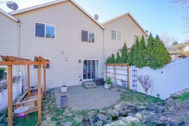 rear view of property featuring a patio area