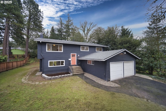 bi-level home with a front lawn