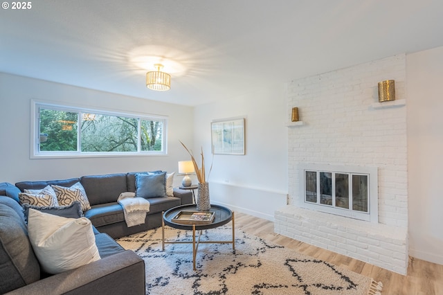 living room featuring a fireplace and light hardwood / wood-style floors