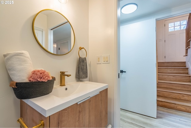 bathroom with vanity and wood-type flooring