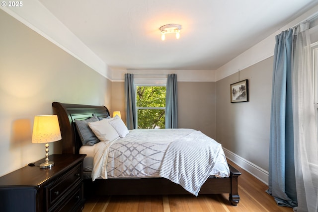 233 SE 28th Ave, Portland, OR 97214 - bedroom featuring wood finished floors and baseboards