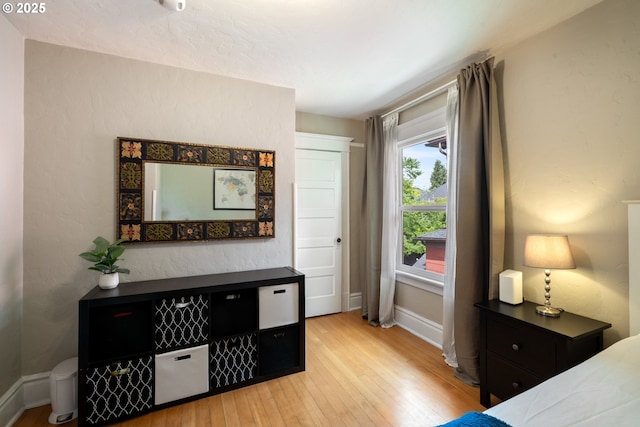 233 SE 28th Ave, Portland, OR 97214 - bedroom with hardwood / wood-style flooring and baseboards