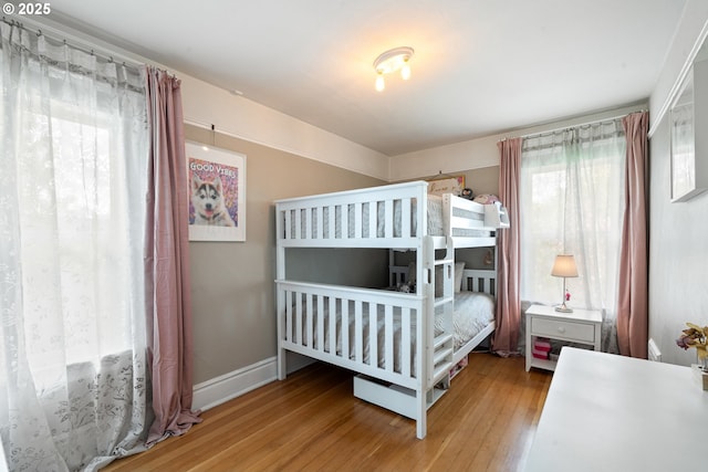 233 SE 28th Ave, Portland, OR 97214 - bedroom featuring hardwood / wood-style floors and baseboards