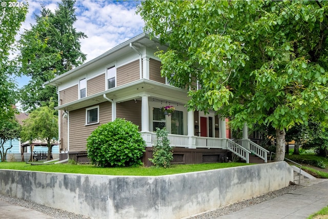 233 SE 28th Ave, Portland, OR 97214 - view of property exterior with a porch and a yard